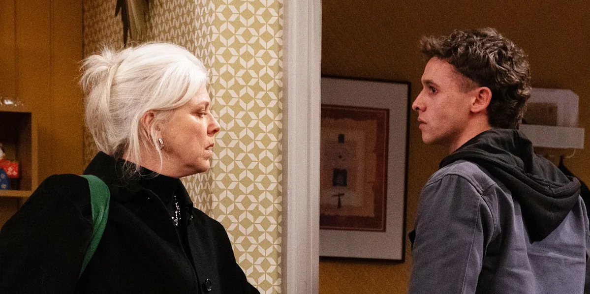 A dramatic scene from Emmerdale featuring Dr Todd and Jacob, with a dark and ominous background, showcasing the intense and troubled relationship between the two characters, with Dr Todd's behaviour becoming increasingly cruel and sinister, Emmerdale