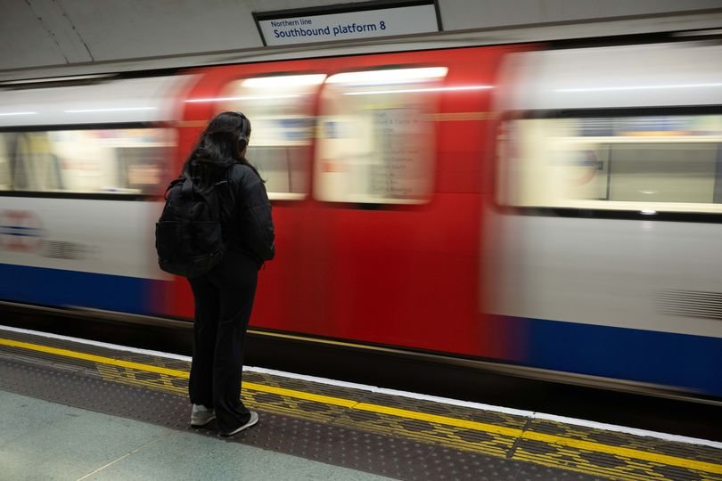 A crowded London Underground train during rush hour, with passengers waiting on the platform, highlighting the impact of Tube strikes on London transport and commuters, with a focus on the worst-hit Underground lines