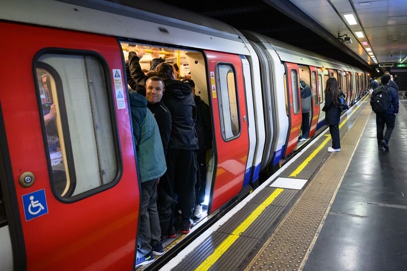 A crowded London tube station with commuters waiting for trains, highlighting the impact of tube strikes on the transport network and the need for effective communication between transport unions and authorities to prevent future disruptions and minimise inconvenience to commuters