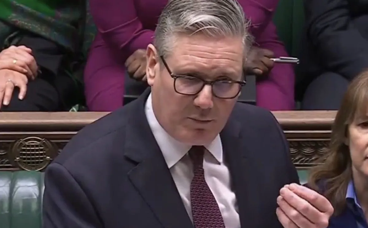 Keir Starmer speaking at a Labour Party conference, with a crowd of supporters in the background, highlighting the party's commitment to its core values and vision for the future of the UK, with a focus on the economy and Brexit