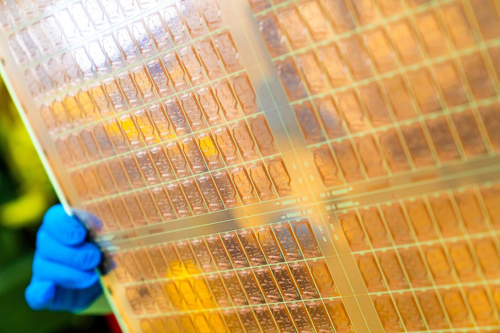 A close-up of a glass core substrate-based chip with an Active Optical Package, showcasing the intricate details of this innovative technology, which is set to transform the UK's technological landscape