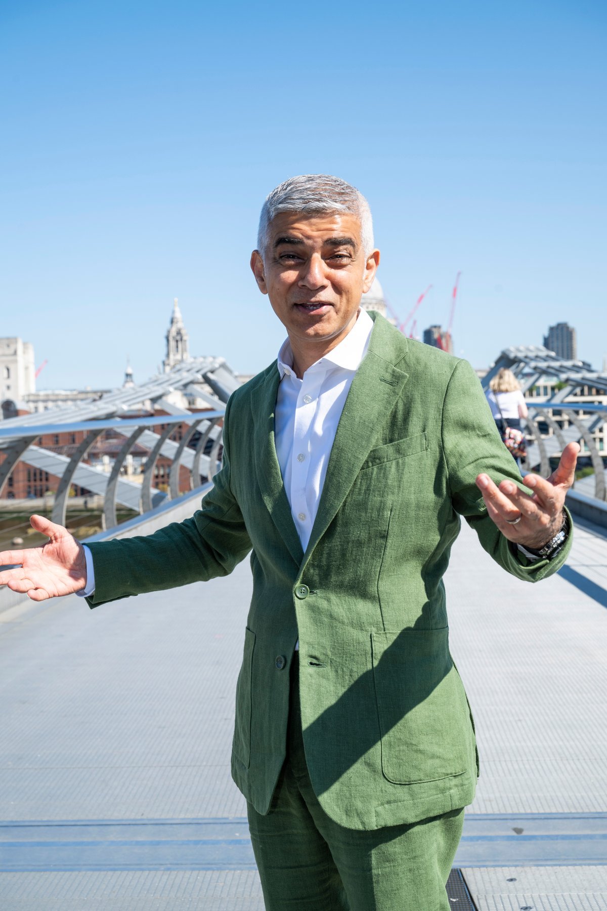 Sadiq Khan, the Mayor of London, standing in front of the London skyline, with a mix of old and new buildings, symbolising his efforts to balance tradition and progress, as he looks out over the city he has served for a decade, with a vision for a more sustainable and equitable future, and a commitment to social justice