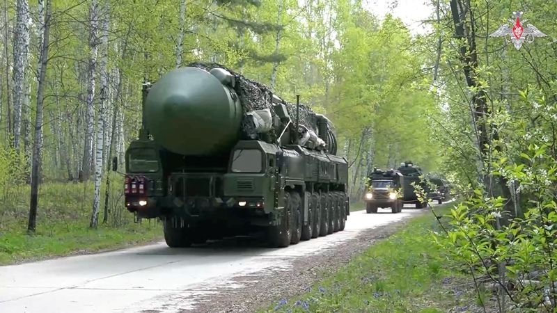 A Russian nuclear missile being launched, symbolizing the country's increasing reliance on its nuclear arsenal as tensions with NATO rise, with a focus on global stability and international relations