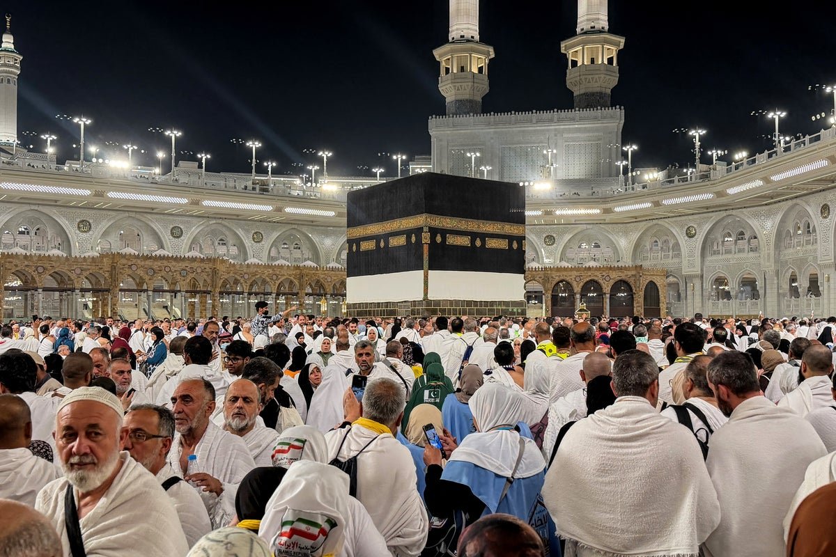 Aerial view of the Hajj pilgrimage in Mecca, Saudi Arabia, with thousands of pilgrims gathered around the Kaaba, highlighting the importance of the event and the potential consequences of disruption with keyword 'Iran strikes'