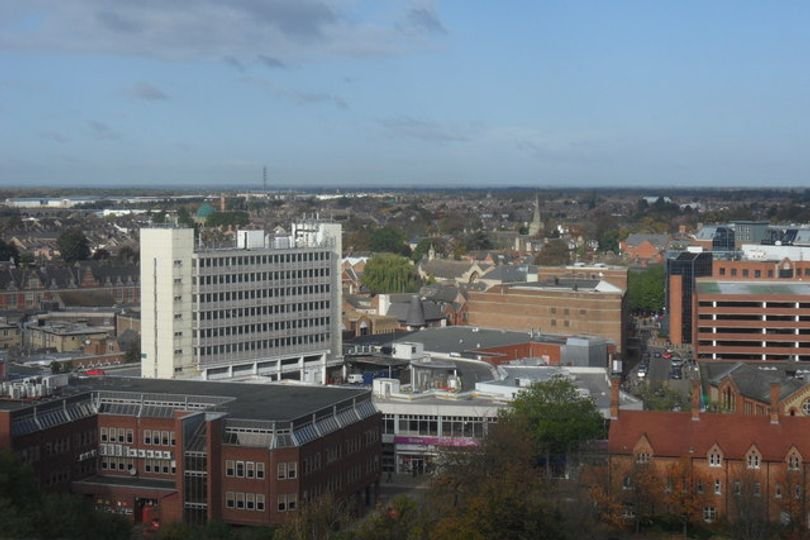 A descriptive image of a London town with a mix of old and new buildings, highlighting the complexity and diversity of the area, with a focus on the keyword 'London towns'