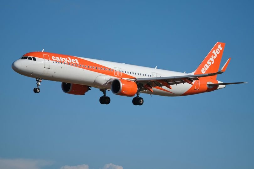 An image of a power bank and luggage, with a plane in the background, highlighting the importance of airline safety and the risks associated with carrying electronic devices in luggage