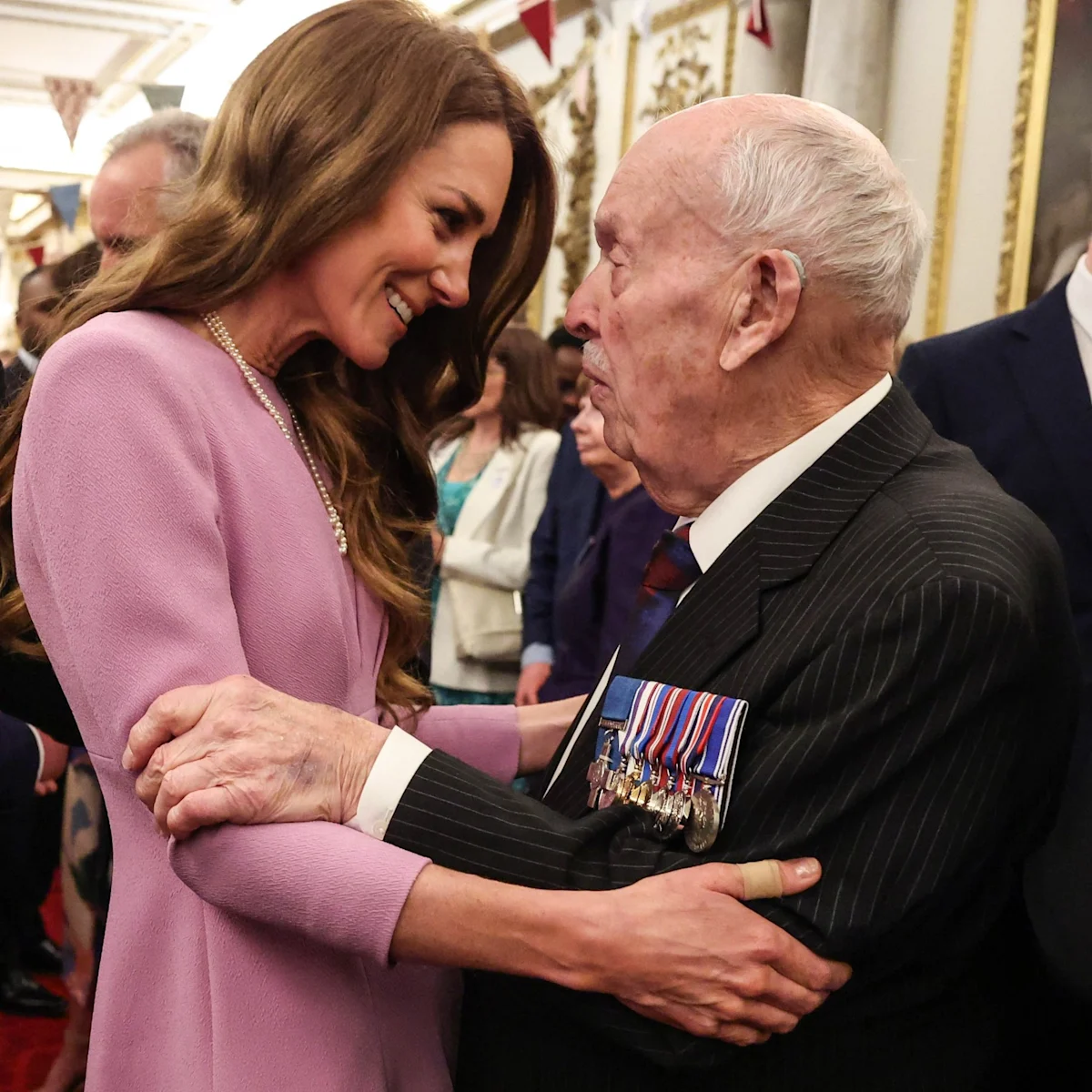 The Princess standing in front of a grand backdrop, wearing a elegant dress and a subtle smile, as she pays tribute to the late Queen's legacy at the centenary celebration, surrounded by dignitaries and royalty