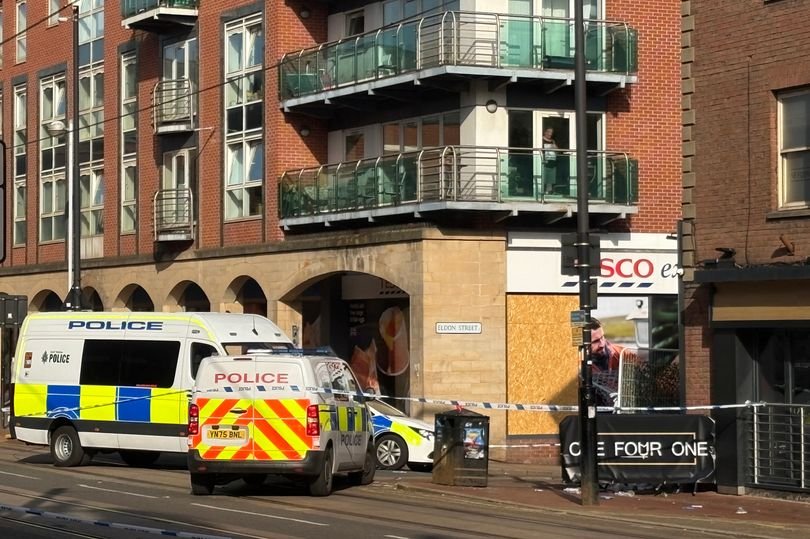 Police cordon outside Sheffield bar where woman was shot dead during Bank Holiday weekend, with forensic experts analysing the scene and two arrests made in Stockport