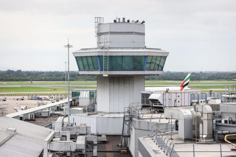 A featured image of Manchester Airport, with a focus on the security measures in place to ensure the safety and well-being of all passengers and staff, including customs officers and security personnel, with a primary keyword of airport security
