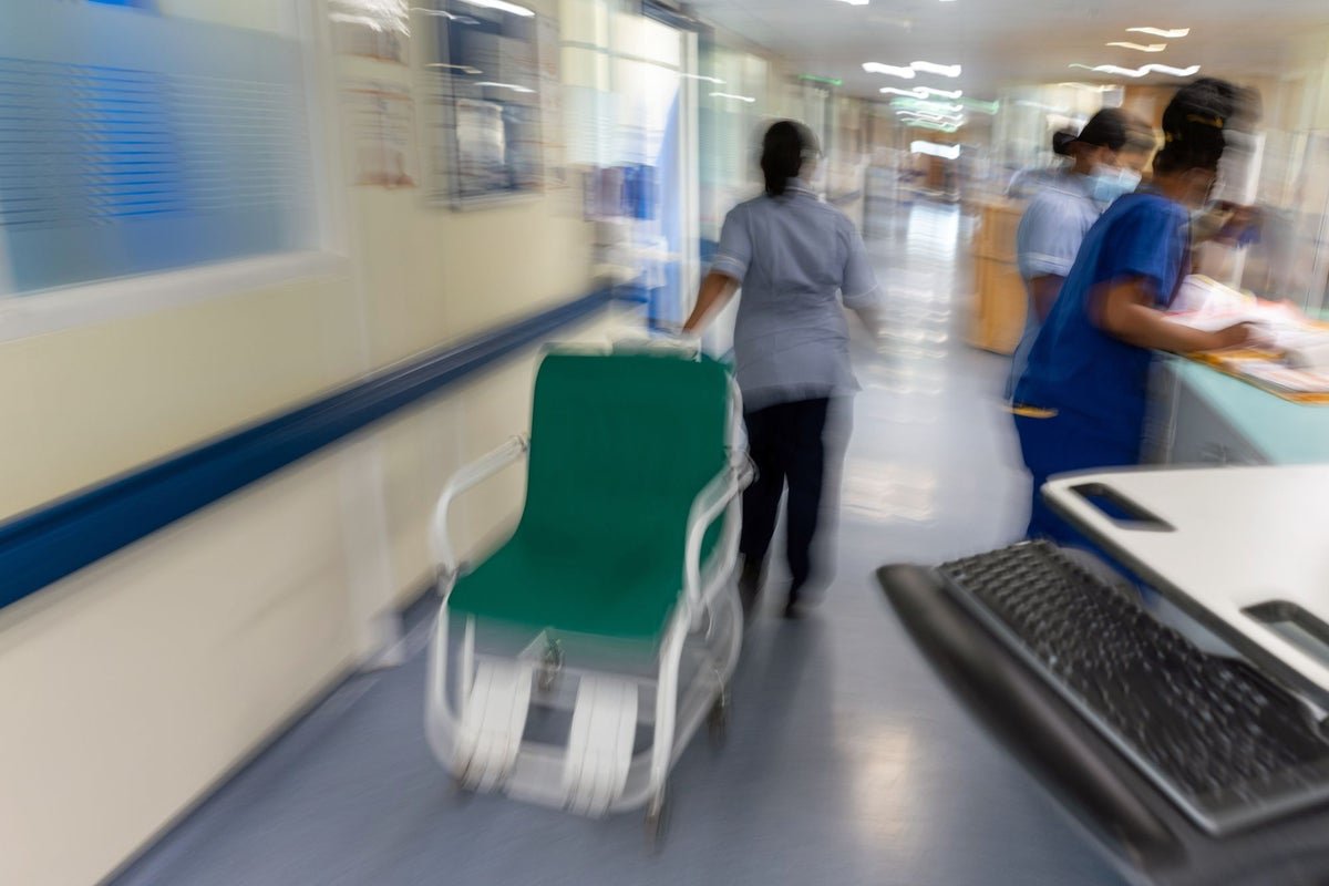 A photo of a nurse in a hospital setting, with a red flag symbolising rogue behaviour, highlighting the issue of NHS nurses who have evaded bans and continued to practice, posing a risk to patient safety and the integrity of the healthcare sector