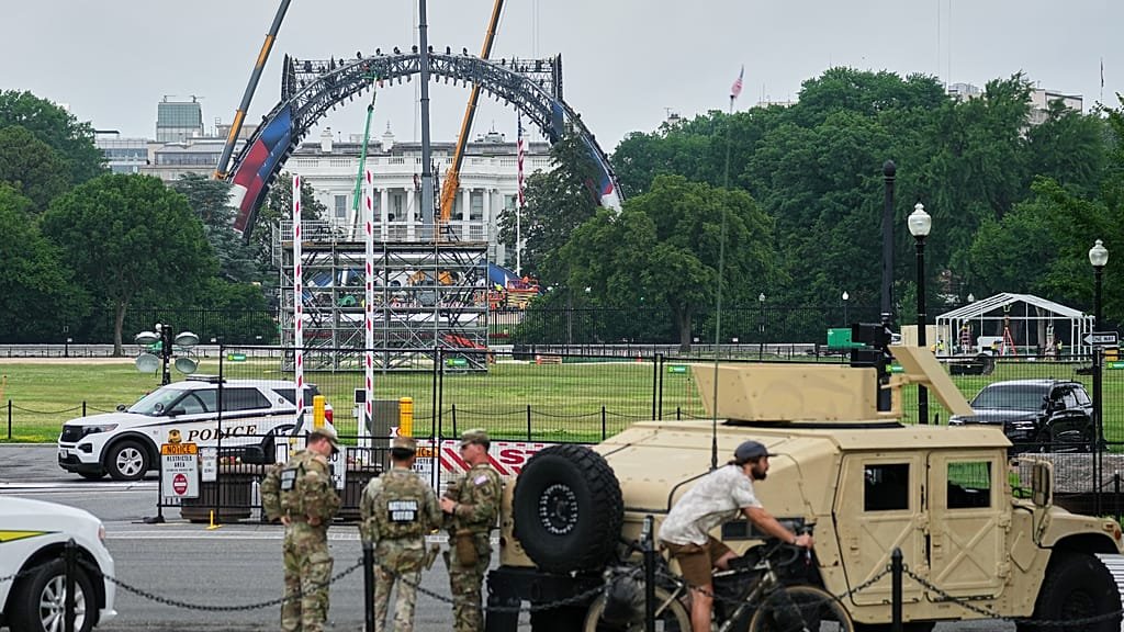 A descriptive image of the UFC fight venue outside the White House, featuring a large octagon and a crowd of spectators, with the White House visible in the background, highlighting the unique location of the event, which is set to feature a thrilling UFC fight on Trump's birthday