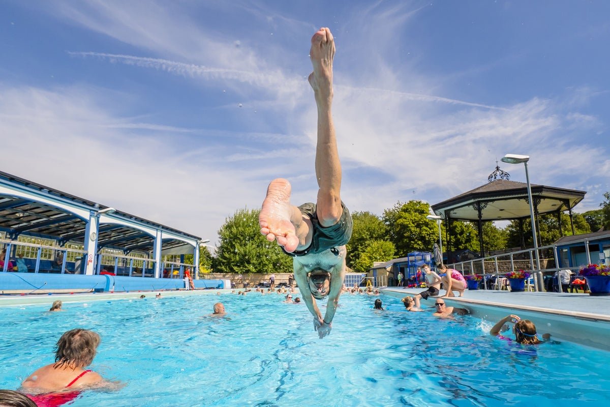 A person swimming in cold water, highlighting the risks of cold water shock during heatwaves, with a focus on water safety and physiological responses to cold water