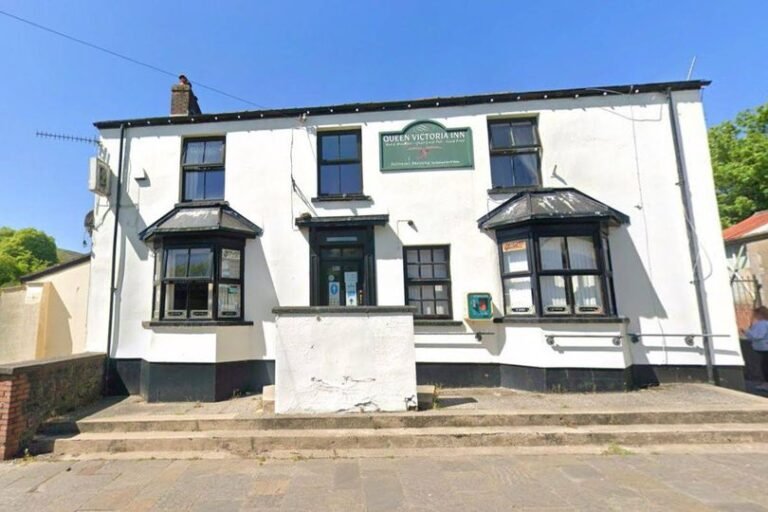 A historic pub building with a sign reading 'Est. 1820' being renovated into modern offices, highlighting the blend of old and new architecture with workers in hard hats and historical preservationists analysing the building's original features