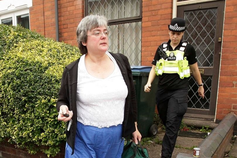 A photo of a cat in a bin, with a woman's hand closing the lid, symbolising the incident that led to Mary Bale being dubbed the 'Cat Bin Lady', with a focus on animal cruelty and welfare