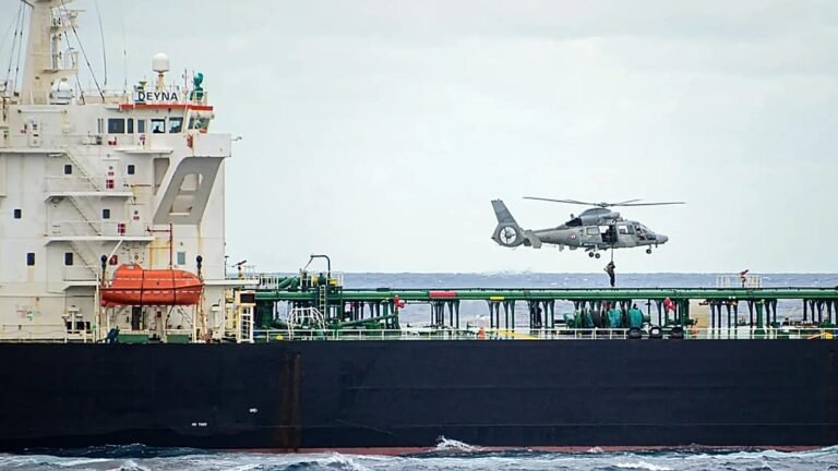 A Russian shadow fleet tanker being intercepted by French and allied forces in a dramatic operation to enforce maritime law and prevent environmental harm, with the primary keyword being Russian shadow fleet