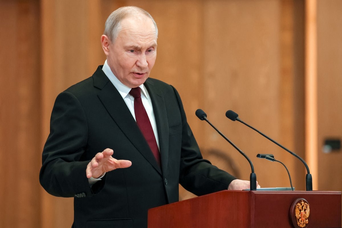 Russian President Vladimir Putin looks on during a meeting with officials, as the Ukraine war rages on and the economic costs become increasingly unsustainable, with the conflict having a devastating impact on the country and the world, including a growing humanitarian crisis and economic instability