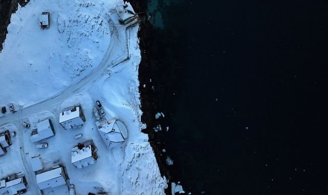 A stunning photograph of Greenland's breathtaking landscape, with its unique culture and natural beauty, as the island navigates its uncertain future and relationship with Denmark, a significant player in the Arctic region