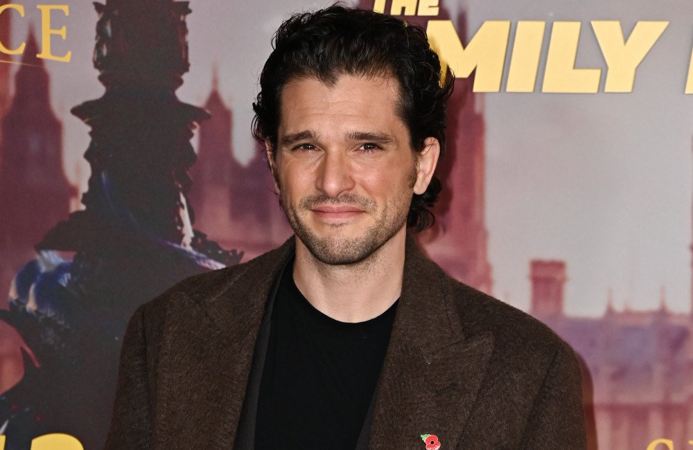 Kit Harington smiles as he attends a Game of Thrones premiere, his journey to self-discovery and recovery from personal struggles a testament to his strength and character, with a mix of colour and emotion in the background