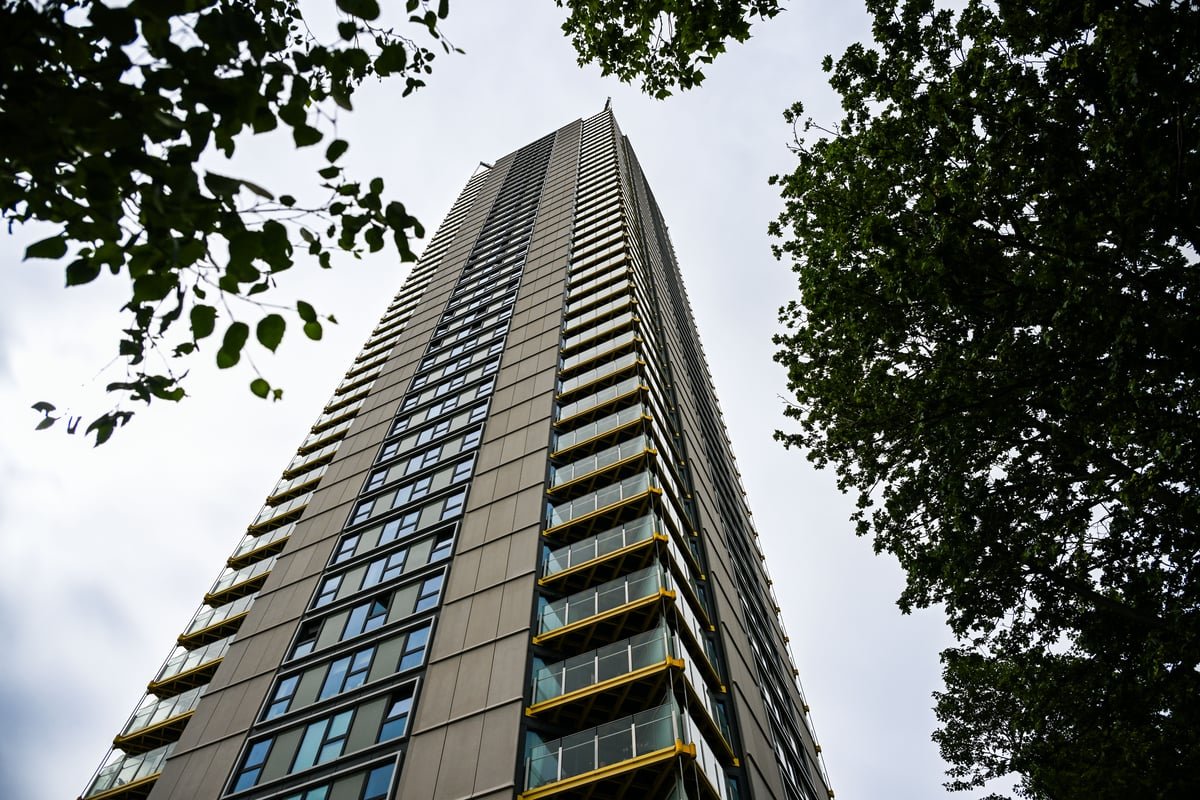 A luxury London tower block with a stunning city view, where a family of three tragically fell to their deaths from the 36th floor, highlighting concerns about high-rise safety and the need for increased support for families in need