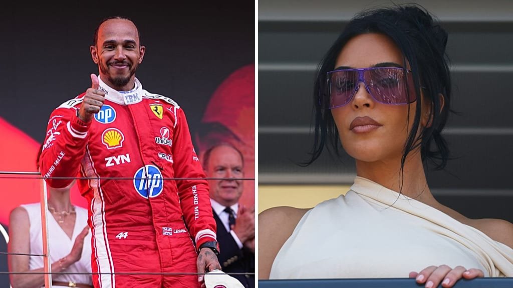 Lewis Hamilton in his Formula 1 car, with a crowd of people in the background, representing the controversy surrounding his anti-billionaire comments, which have sparked a heated debate about the billionaire class and the power of words
