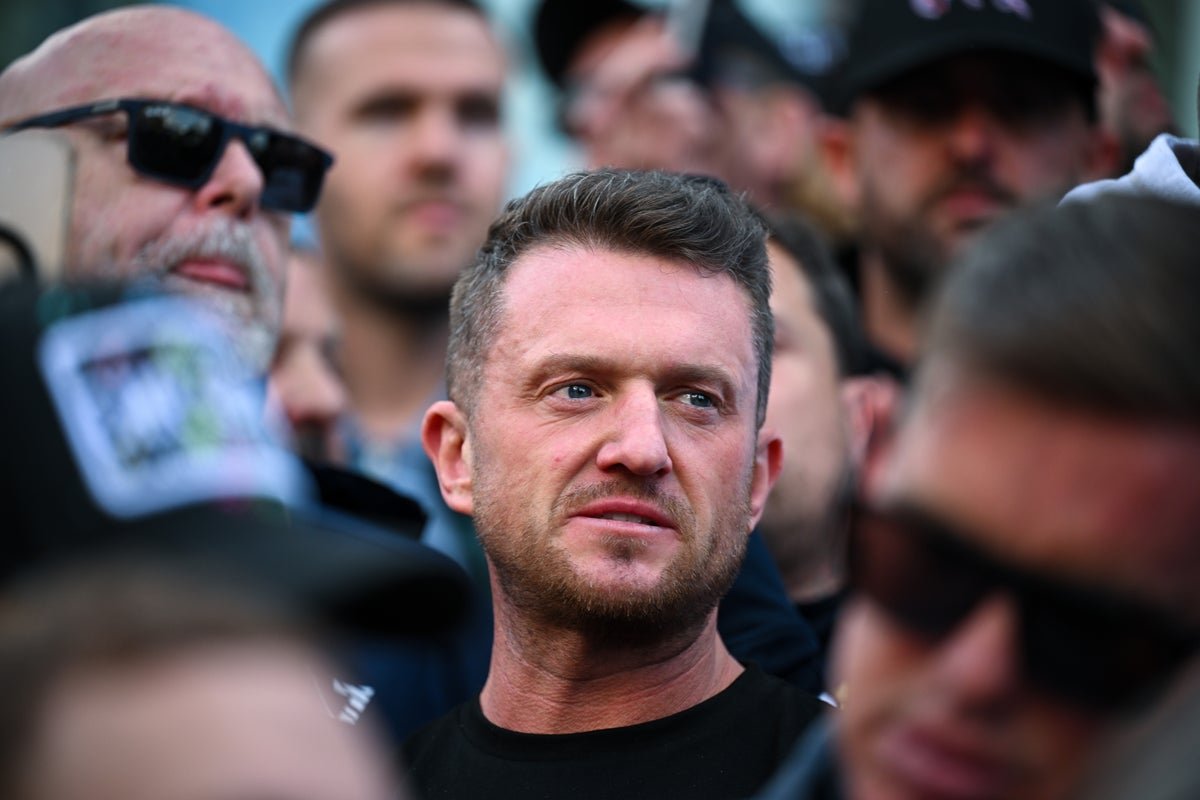 Tommy Robinson meeting Elon Musk's father in Moscow, sparking controversy and debate about Russia and UK politics, with a complex geopolitical landscape in the background