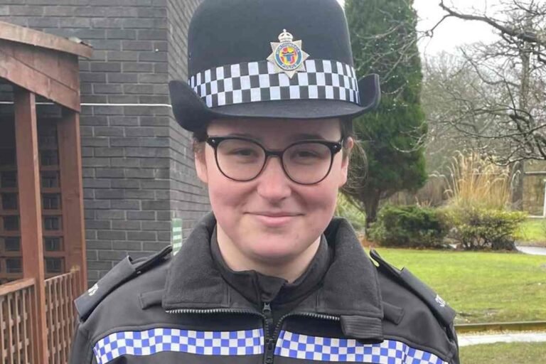 A police officer's memorial, with flowers and tributes from the community, highlighting the importance of road safety and community support for police officers, particularly in the aftermath of a tragic accident