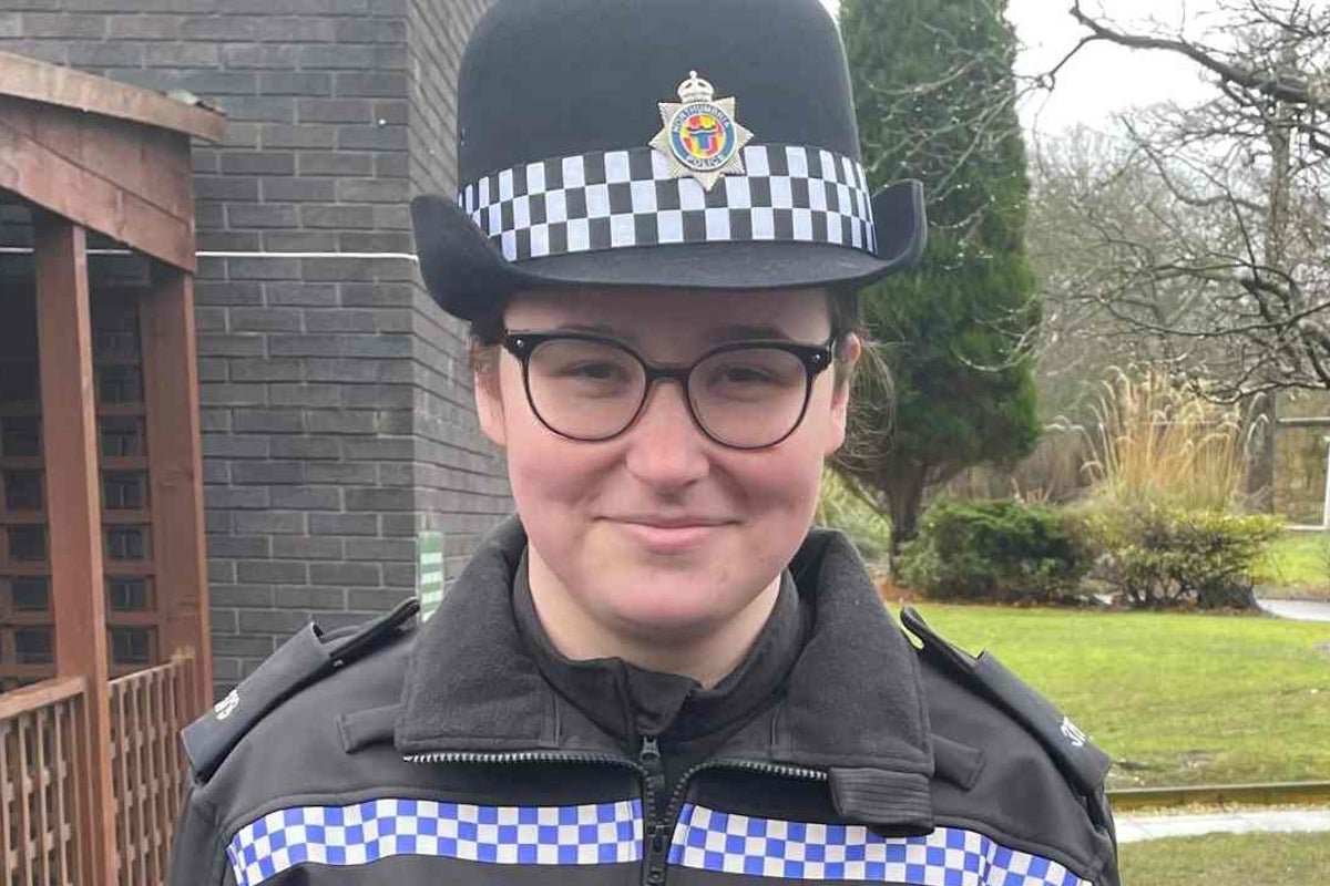A police officer's memorial, with flowers and tributes from the community, highlighting the importance of road safety and community support for police officers, particularly in the aftermath of a tragic accident