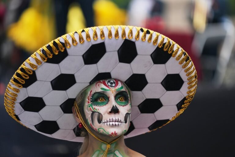 A crowd of Mexican protesters holding signs and banners, with a giant Mexican flag waving in the background, as the country's social tensions and protests continue to escalate, with the primary keyword phrase Mexico World Cup celebrations being overshadowed by the unrest
