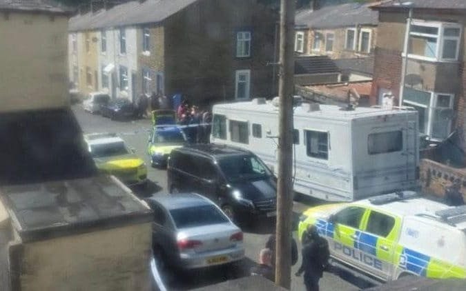 A teenage girl is being treated for a neck stabbing in a street attack, with the primary keyword being street attack and the image depicting a concerned community coming together to support the victim