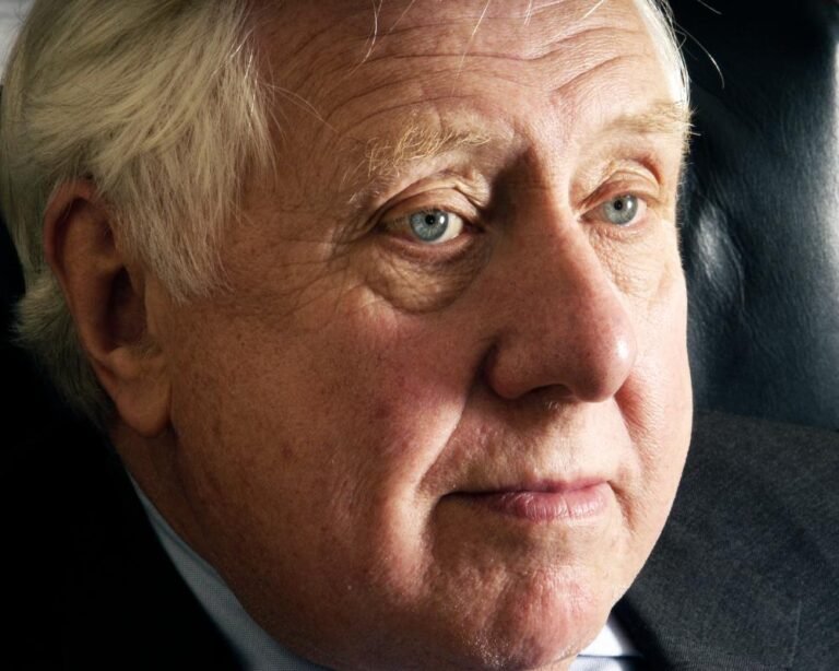 Portrait of Roy Hattersley, former Labour deputy leader, with a descriptive caption highlighting his contributions to the Labour movement and British politics, including his commitment to social justice and his role in shaping the Labour party's policy agenda