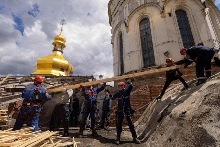 A historic monastery in Kyiv, Ukraine, with colourful architecture and stunning frescoes, undergoing restoration after being damaged in conflicts, a prominent landmark and cultural heritage site