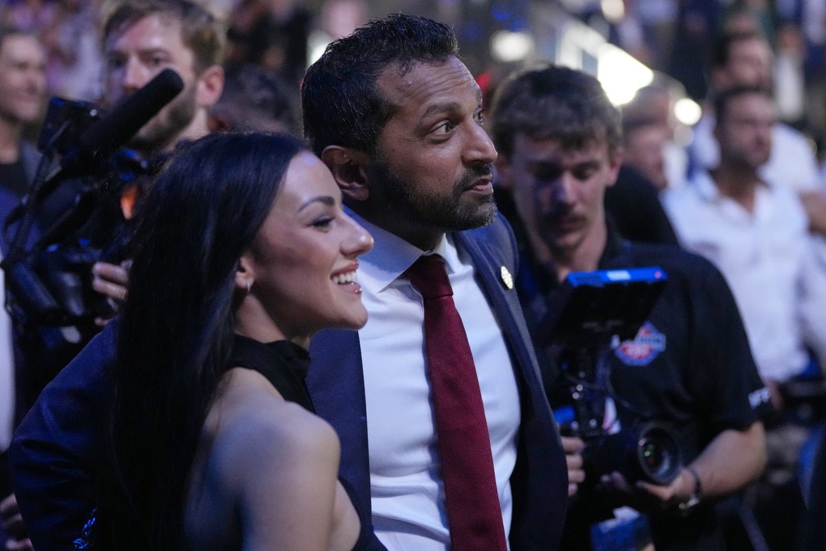 FBI Director Kash Patel at a press conference, with a stern expression, discussing the foiled terror plot at a UFC event, with a hint of tension in the air, and a sense of urgency in his behaviour, as he analyses the situation