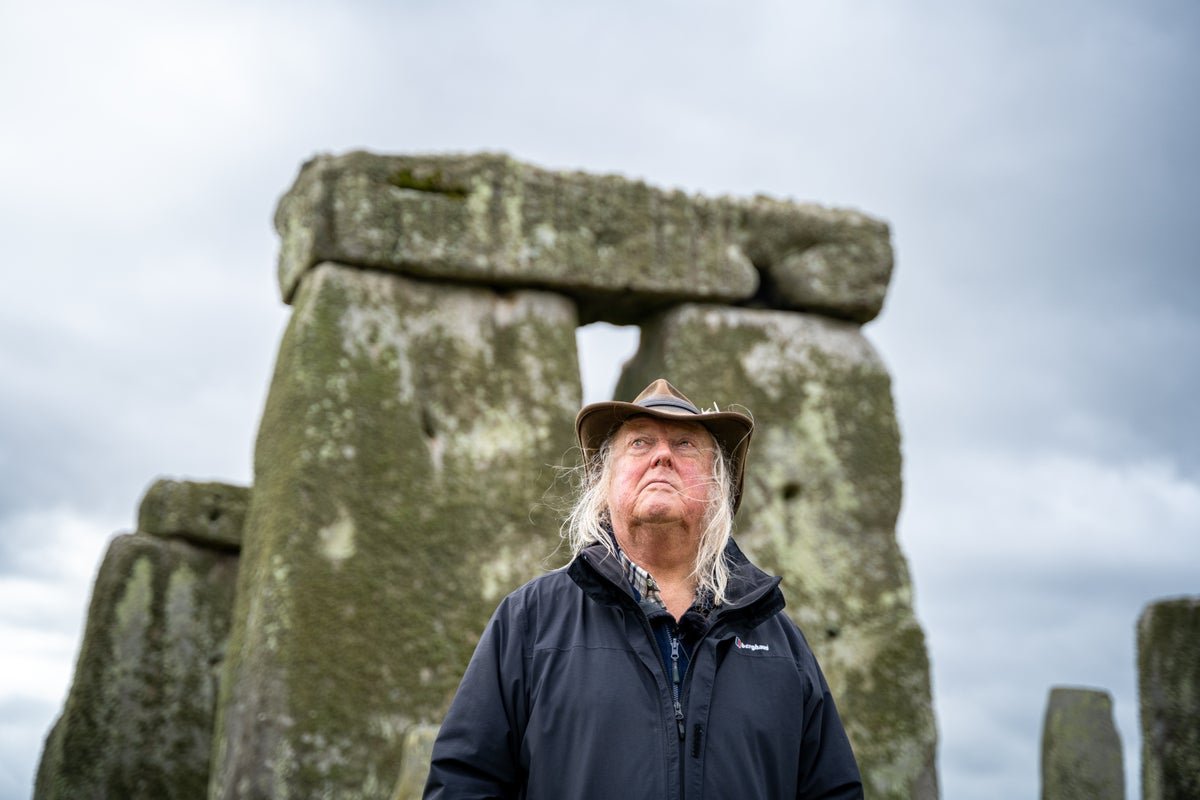 Aerial view of Stonehenge, with its towering stones and intricate carvings, set against the picturesque English countryside, highlighting the primary keyword of ancient monument