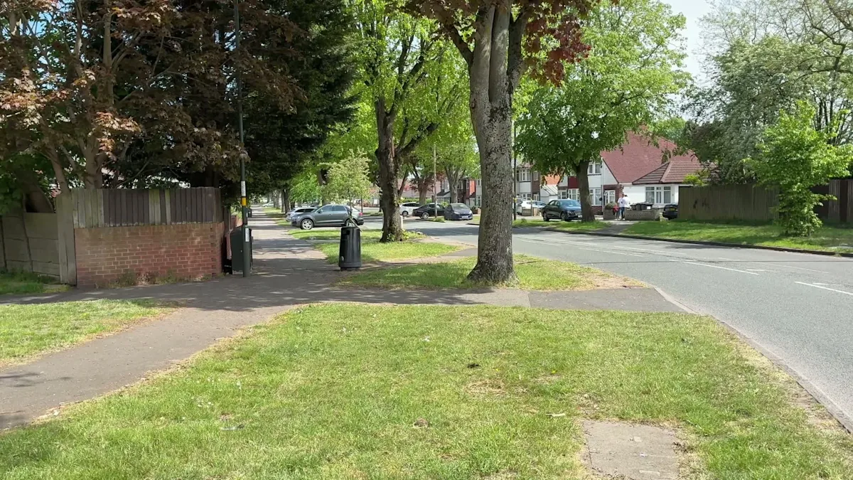 A vibrant mix of flowers left at the scene in Hodge Hill, a colourful and emotional tribute to a loved one, symbolising hope and resilience in the community