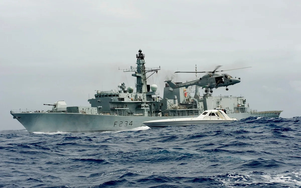 The Royal Navy's frigate fleet in action, with the HMS Iron Duke in the foreground, highlighting the importance of these ships in defending the UK's interests and the impact of their reduction on the Navy's capabilities