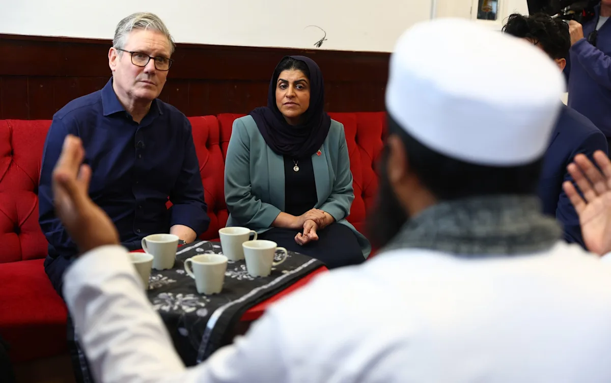 A group of Muslim voters discussing politics, with a mix of ages and backgrounds, highlighting the diversity of the Muslim community in the UK, and their growing dissatisfaction with the Labour Party