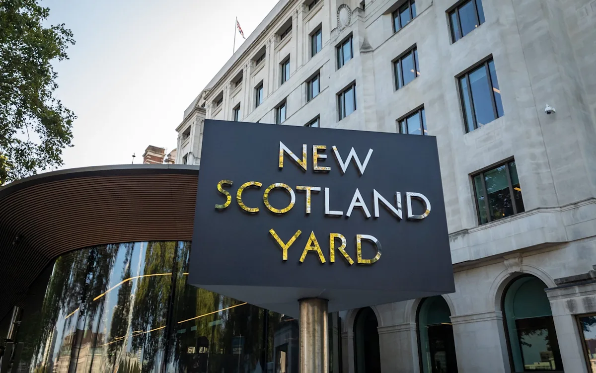 A TV chef in a kitchen, with a shocked expression on their face, as allegations of rape emerge, highlighting the serious nature of the behaviour in question