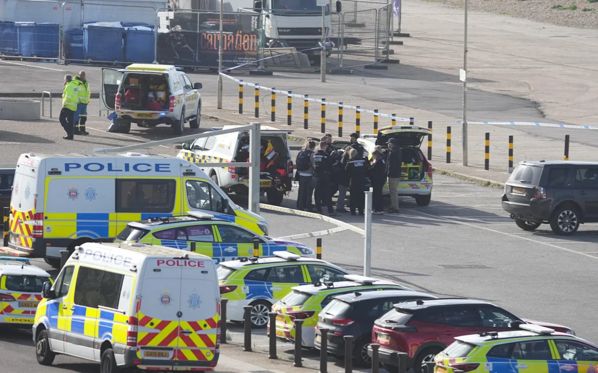 A sombre scene at Brighton beach as emergency services recover the bodies of three women from the sea, with the primary keyword being Brighton beach tragedy