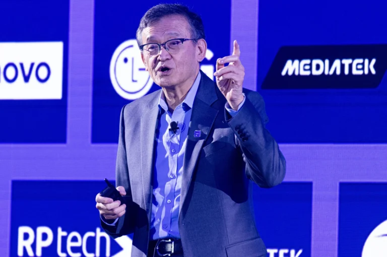 Intel CEO Lip-Bu Tan speaking at a conference, with a focus on the company's Foundry in the UK and the upcoming 14A PDK 0.9, a significant development for the UK's tech industry, highlighting the company's commitment to quality and innovation in the UK