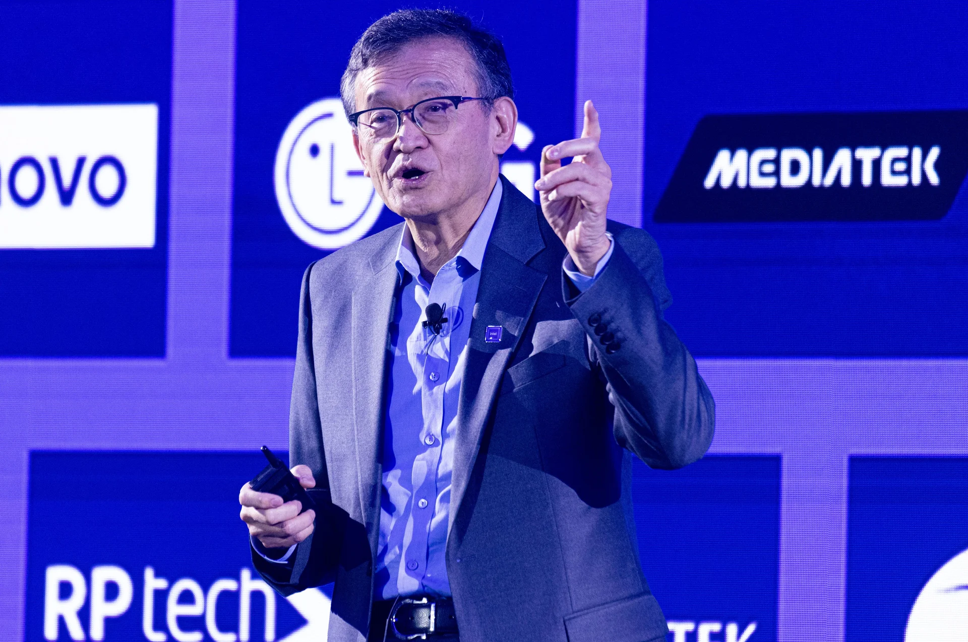 Intel CEO Lip-Bu Tan speaking at a conference, with a focus on the company's Foundry in the UK and the upcoming 14A PDK 0.9, a significant development for the UK's tech industry, highlighting the company's commitment to quality and innovation in the UK