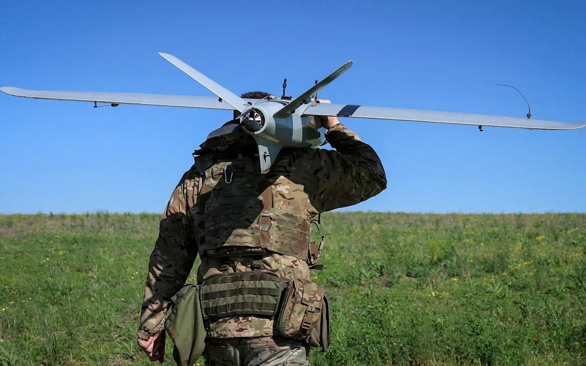 A Ukrainian drone in flight, with a caption reading 'Putin's forces have hijacked Ukrainian drones, raising concerns about European security'