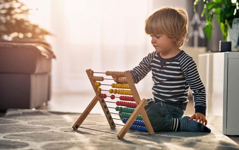 child saving money in piggy bank
