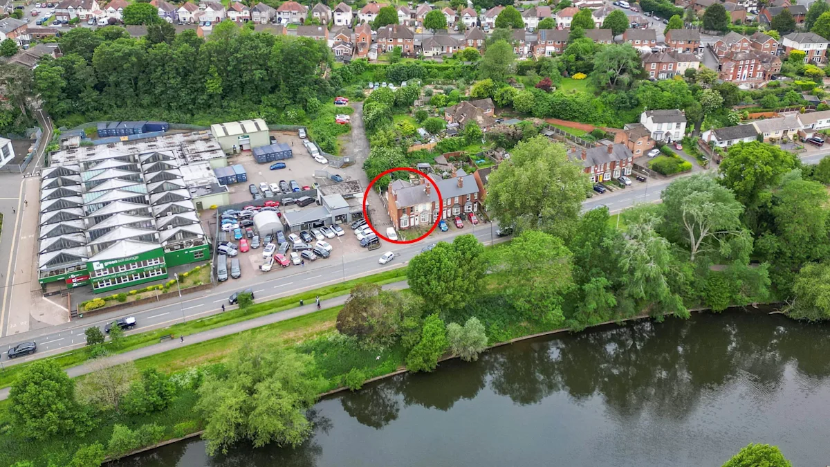 A stunning Victorian home with riverside views, boasting intricate facades and ornate details, perfect for those seeking a unique and historic property investment opportunity with breathtaking views of the river