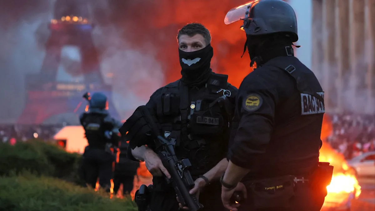 Riot police clash with PSG fans in Paris following Champions League win, with hundreds arrested and widespread destruction