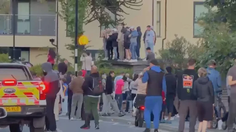 Riot police in Southampton clash with protesters, with a sea of colourful banners and flags on display, as the city grapples with the implications of this volatile confrontation