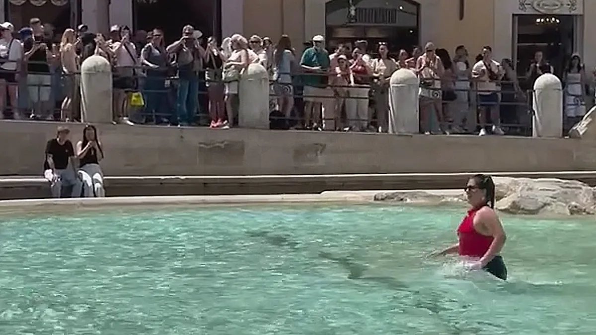 The Trevi Fountain in Rome, a beautiful baroque masterpiece and one of the city's most beloved landmarks, with a stunning display of water features and intricate stonework, attracting millions of visitors each year, and a recent setting for an ill-advised influencer swim