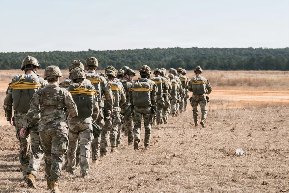 A US soldier in uniform, with a desert landscape in the background, highlighting the challenges of military intervention in Iran, with the primary keyword being Iran control