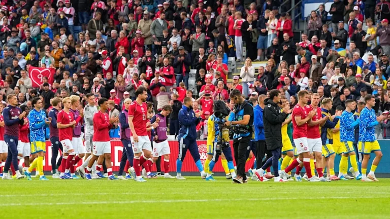 Christian Eriksen collapses on the pitch during Denmark's Euro 2020 match against Finland, sparking widespread concern among fans and players, with the primary keyword being Christian Eriksen collapse