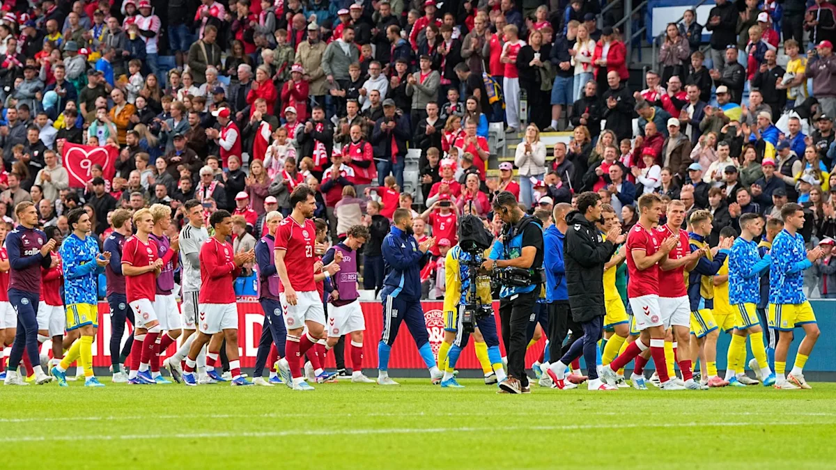 Christian Eriksen collapses on the pitch during Denmark's Euro 2020 match against Finland, sparking widespread concern among fans and players, with the primary keyword being Christian Eriksen collapse