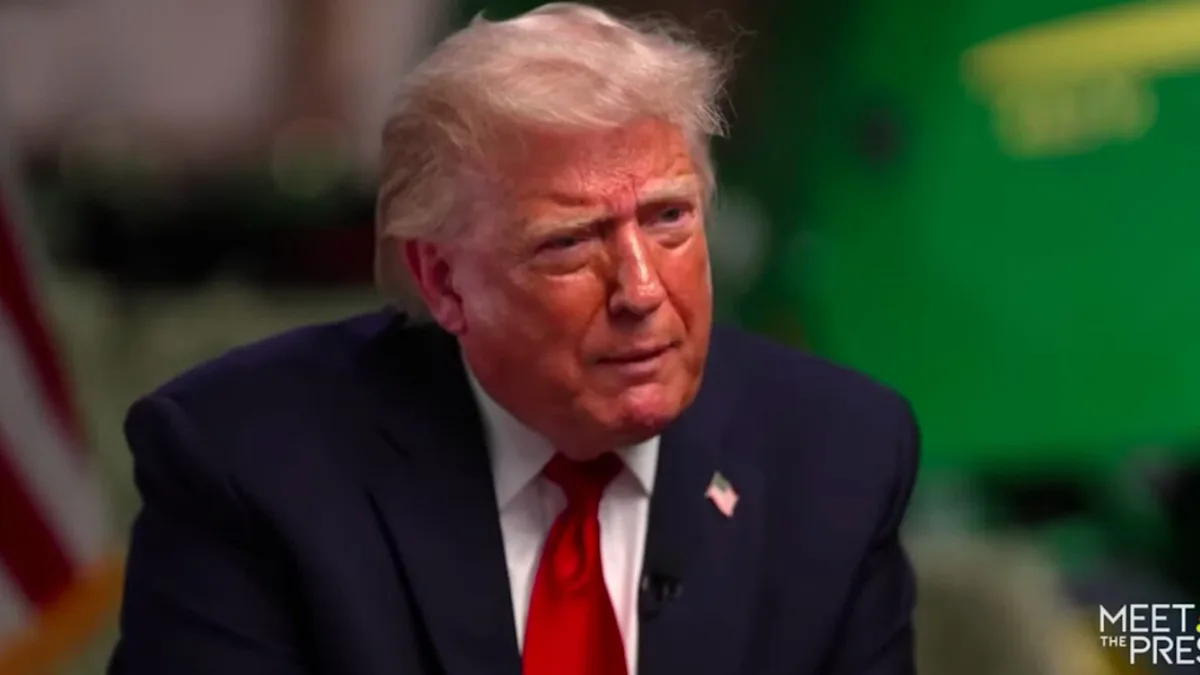 Donald Trump speaking at a podium with a serious expression, discussing his view on warfare and conflict, with a subtle background colour, the primary keyword 'warfare' is visible in the foreground